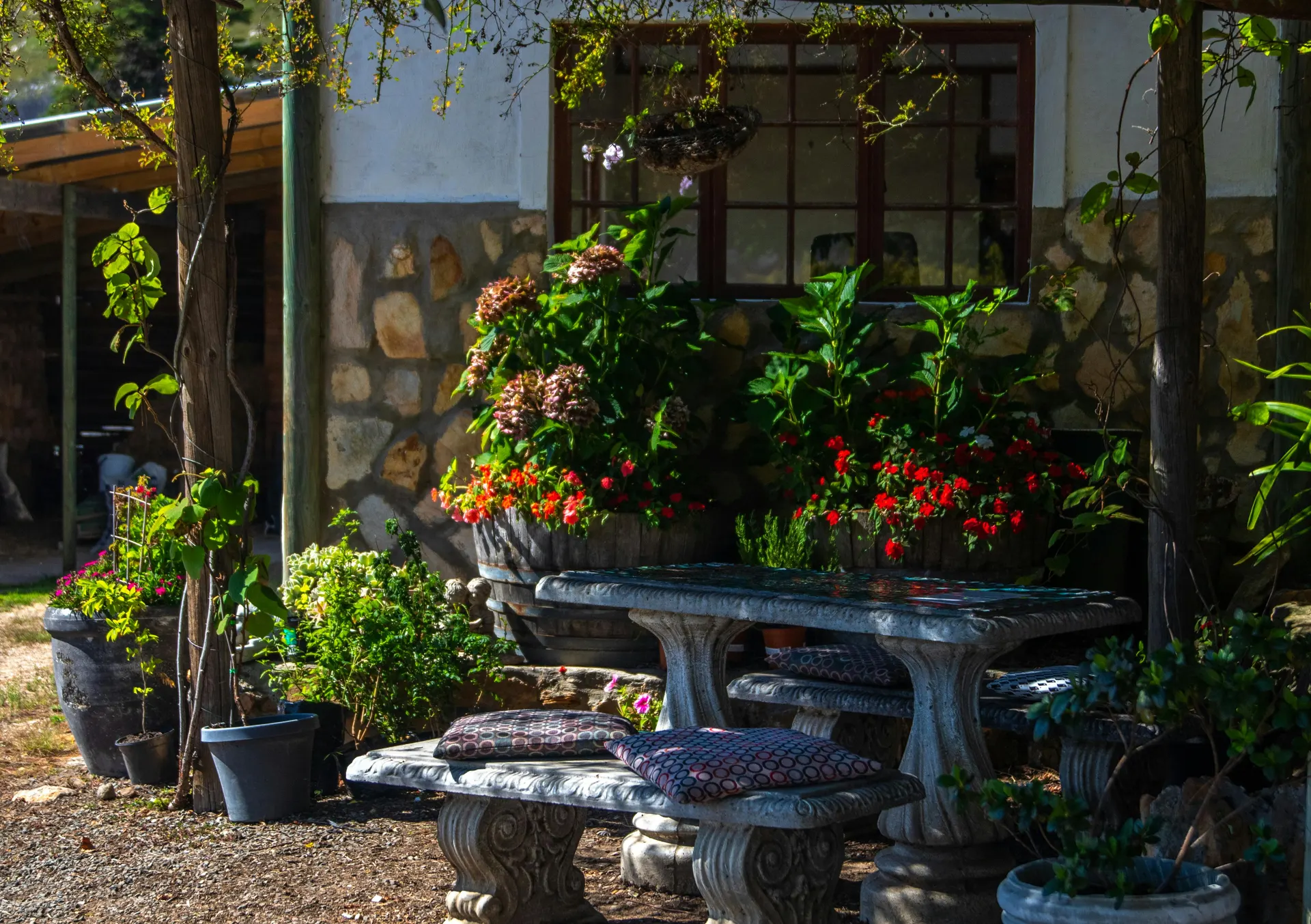 Travellers enjoying a calm Malaysian countryside retreat near floral gardens